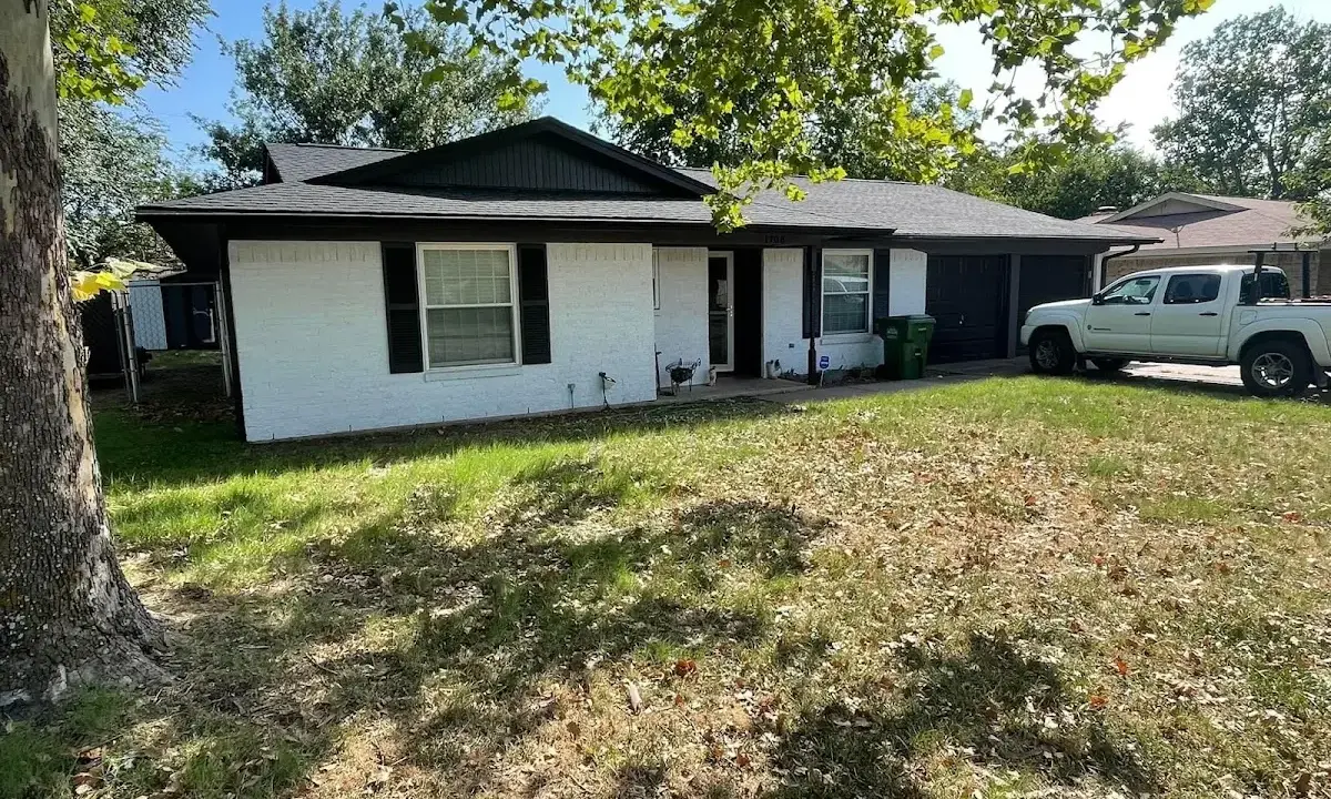 Professional roofing crew working on a residential roof in Canton